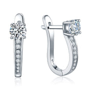 Sparkling moissanite hoop earrings in silver on a white background